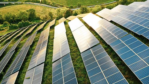 Solar panels fields on green hills