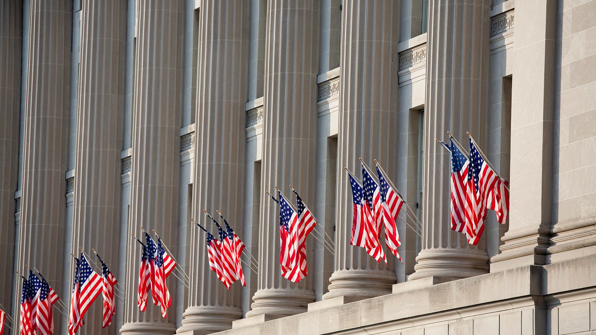 US flag decorations between columns