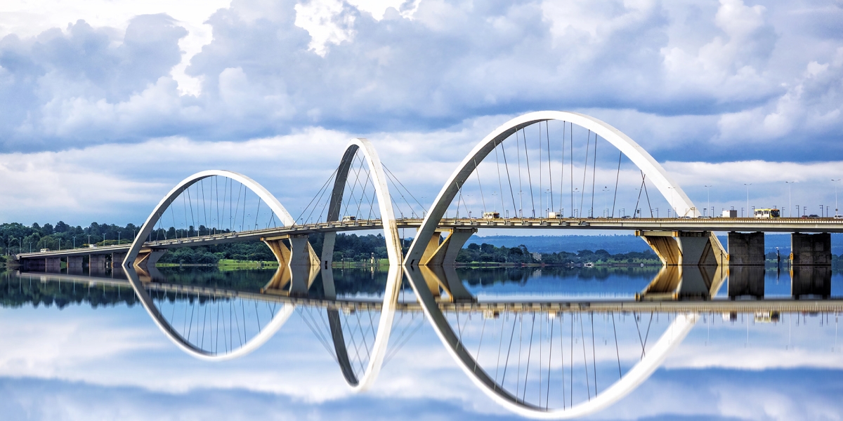 Bridge with rounded arches and reflection in the river
