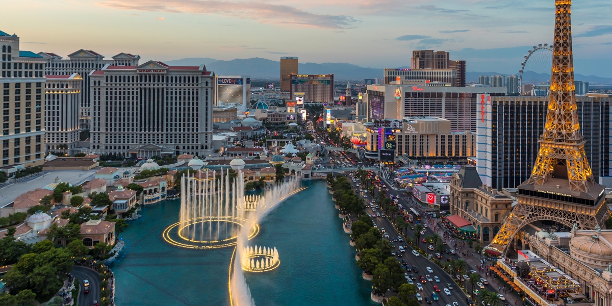 USA, Nevada, Las Vegas, Strip, fountain, hotels and Eiffel Tower at blue hour