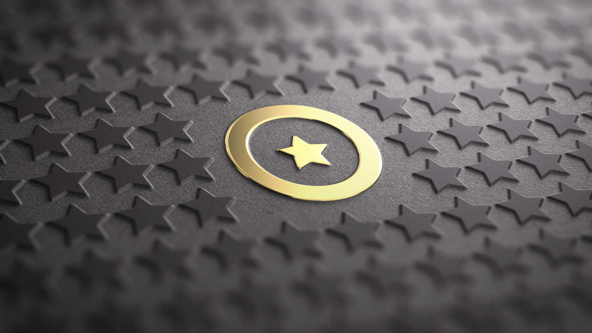 Gold star surrounded by grey stars