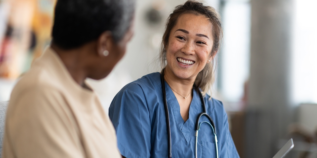 Healthcare Worker Smiling at Patient